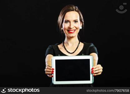 Technology internet business concept. Fashion woman retro style red lips nails showing tablet touchpad with copy space on black