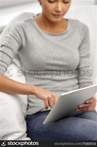 technology, internet, communication and people concept - close up of young woman with tablet computer. close up of young woman with tablet computer