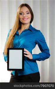 Technology internet concept. Business woman or student girl with tablet, showing blank copy space on screen touchpad indoor