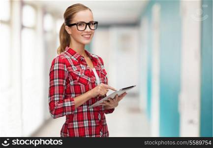 technology, internet, education and people concept - smiling girl in eyeglasses with tablet pc computer at school corridor