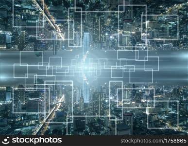 Technology Internet of thing over the Panorama of Bangkok cityscape at night time, Business Architecture and building with tourist, Technology smart city and internet of thing concept,