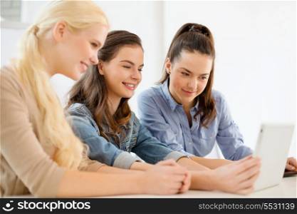 technology, internet, school and education concept - group of smiling teenage students with tablet pc computer at school