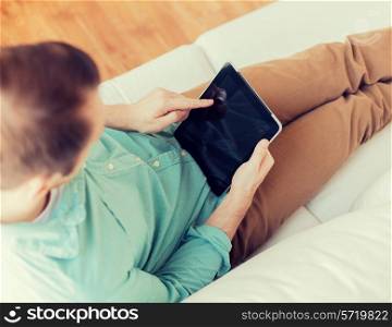 technology, leisure, lifestyle, distance learning and advertisement concept - close up of man working with tablet pc computer pointing finger at home