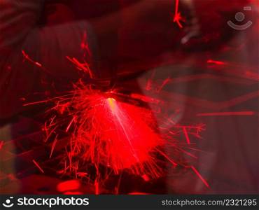 Technology, machines concept. Industrial laser cutting steel metal with bright red sparks. Laser cutting steel metal with bright sparks