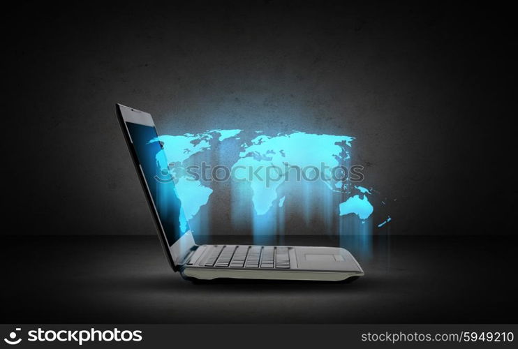 technology, mass media and global business concept - open laptop computer with world map over dark gray background