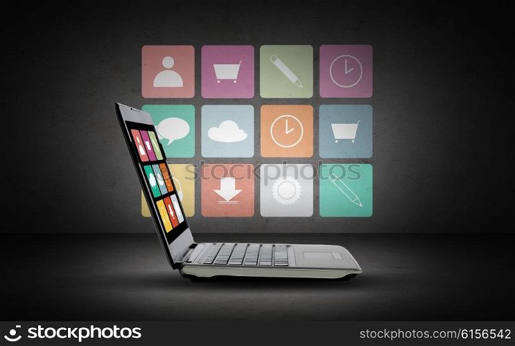 technology, media, multimedia and advertisement concept - laptop computer with application icons menu on screen