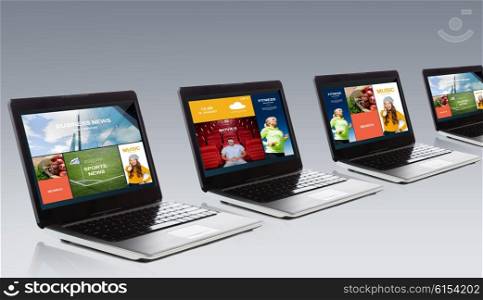 technology, media, multimedia and advertisement concept - laptop computer with internet applications on screen over gray background