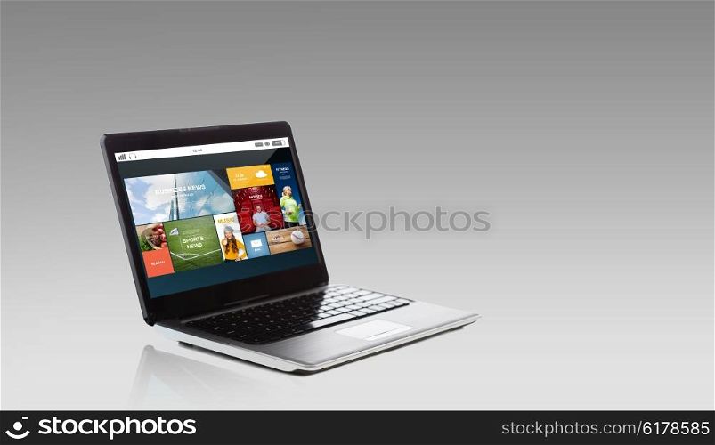 technology, media, multimedia and advertisement concept - laptop computer with internet applications on screen over gray background