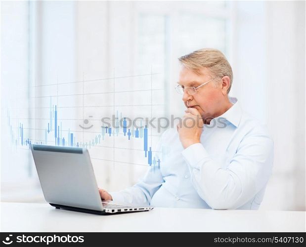 technology, money, oldness and business concept - old man in eyeglasses with laptop computer and forex chart at home