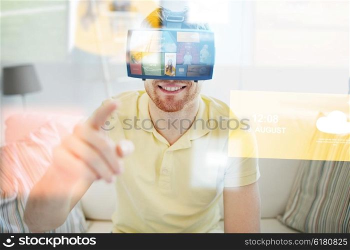 technology, multimedia, mass media, entertainment and people concept - happy young man in virtual reality headset or 3d glasses with media or web applications at home