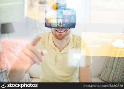 technology, multimedia, mass media, entertainment and people concept - happy young man in virtual reality headset or 3d glasses with media or web applications at home