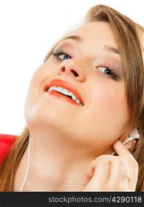 Technology, music and happiness concept - girl teenage in earphones listening music