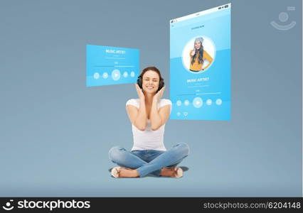 technology, music, multimedia and happiness concept - smiling young woman or teen girl in headphones over media player screen and blue background