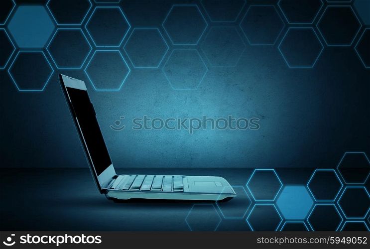 technology, network and internet connection concept - open laptop computer with blank screen and hexagonal pattern over dark gray background