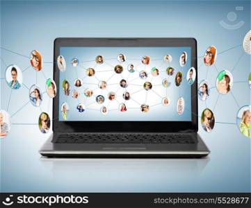 technology, networking and communication concept - laptop computer with social network on screen