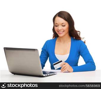 technology, online shopping and payment concept - smiling woman with laptop computer and credit card