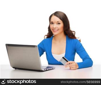 technology, online shopping and payment concept - smiling woman with laptop computer and credit card