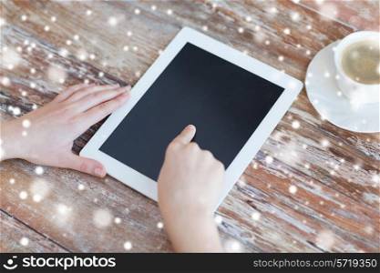 technology, people and home concept - close up of female hands pointing finger to black blank tablet pc computer screen