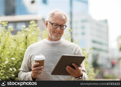 technology, people and lifestyle concept - senior man with tablet pc computer and coffee on city street
