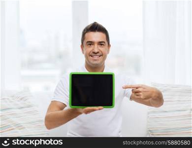 technology, people and lifestyle, distance learning concept - happy man showing tablet pc computer black blank screen at home