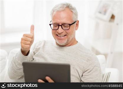 technology, people and lifestyle, distance learning concept - happy senior man with tablet pc computer having video call at home