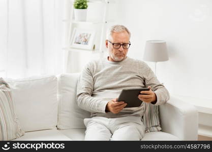 technology, people and lifestyle, distance learning concept - senior man with tablet pc computer at home