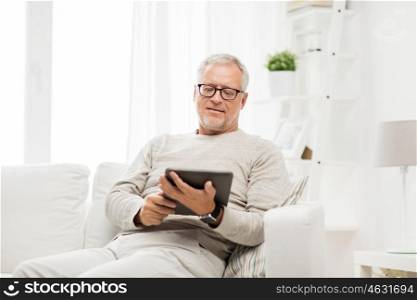 technology, people and lifestyle, distance learning concept - senior man with tablet pc computer at home