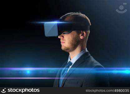 technology, people, cyberspace and augmented reality concept - young businessman with virtual headset or 3d glasses over black background and laser light. businessman in virtual reality glasses or headset