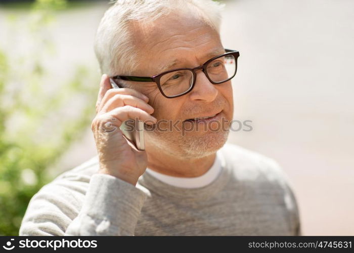 technology, people, lifestyle and communication concept - happy senior man calling on smartphone in city