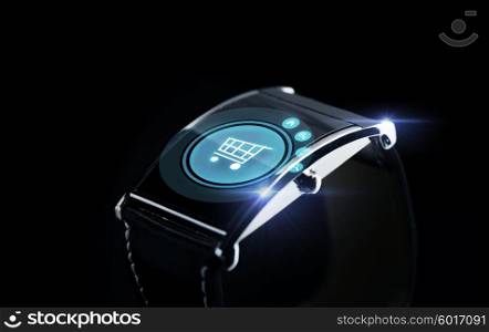 technology, sale, commerce and object concept - close up of black smart watch with shopping cart icon on screen