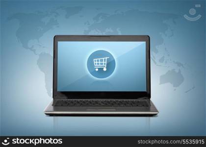 technology, shopping and advertisement concept - laptop computer with shopping cart button on screen