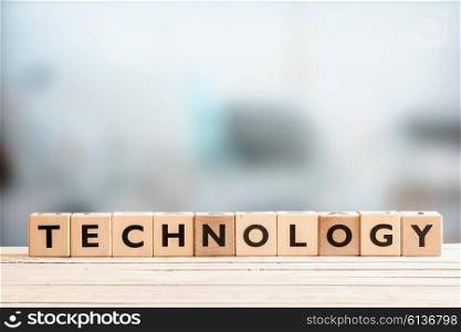 Technology sign made of blocks on a wooden desk