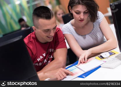 technology students group in computer lab school classroom working on