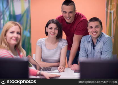 technology students group in computer lab school classroom working on