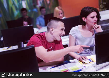 technology students group in computer lab school classroom working on