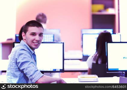 technology students group in computer lab school classroom working on