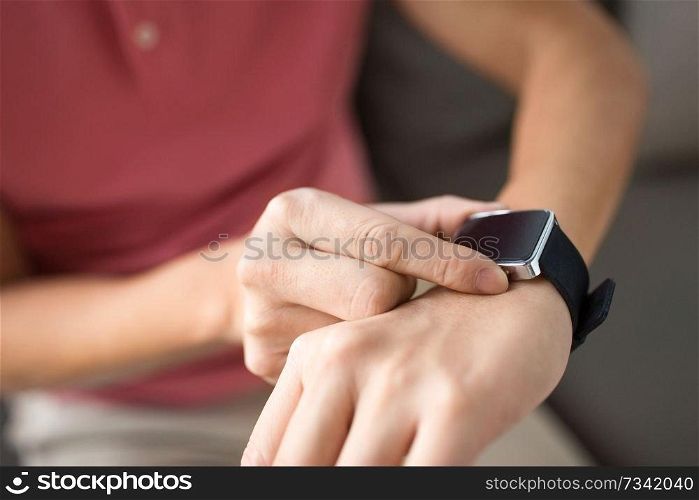 technology, time and people concept - close up of male hands with smart watch. close up of male hands with smart watch