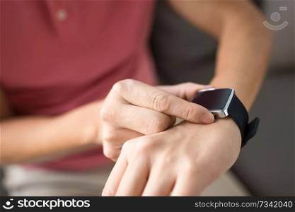 technology, time and people concept - close up of male hands with smart watch. close up of male hands with smart watch