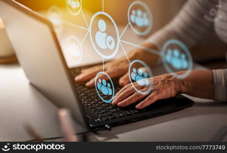 technology, virtual communication and media concept - close up of senior woman hands typing on laptop at home over social network contacts. hands of old woman with laptop and social network