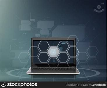 technology, virtual reality and network connection concept - laptop computer with hexagonal projection over dark gray background