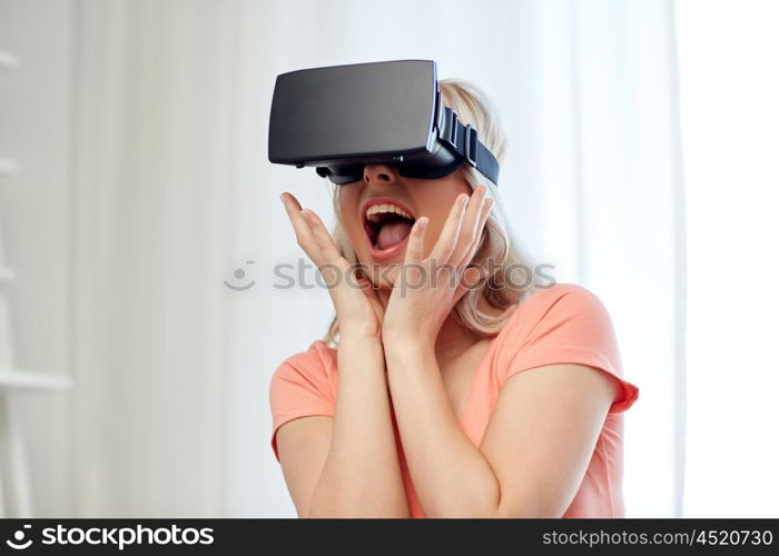 technology, virtual reality, cyberspace, entertainment and people concept - happy amazed young woman with virtual reality headset or 3d glasses at home