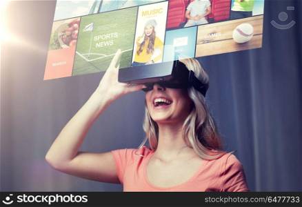 technology, virtual reality, cyberspace, entertainment and people concept - happy young woman with virtual reality headset or 3d glasses at home looking at news projection. woman in virtual reality headset or 3d glasses. woman in virtual reality headset or 3d glasses