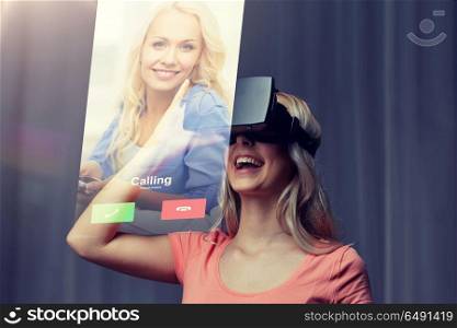 technology, virtual reality, cyberspace, entertainment and people concept - happy young woman with virtual reality headset or 3d glasses at home looking at incoming call projection. woman in virtual reality headset or 3d glasses. woman in virtual reality headset or 3d glasses