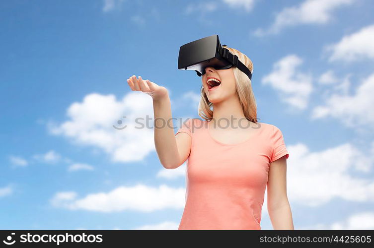 technology, virtual reality, entertainment and people concept - happy young woman with virtual reality headset or 3d glasses over blue sky and clouds background