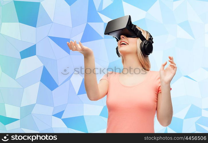 technology, virtual reality, entertainment and people concept - happy young woman with virtual reality headset or 3d glasses over blue low poly texture background