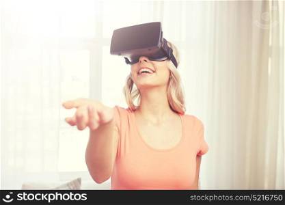 technology, virtual reality, entertainment and people concept - happy young woman with virtual reality headset or 3d glasses playing game at home and holding something invisible. woman in virtual reality headset or 3d glasses