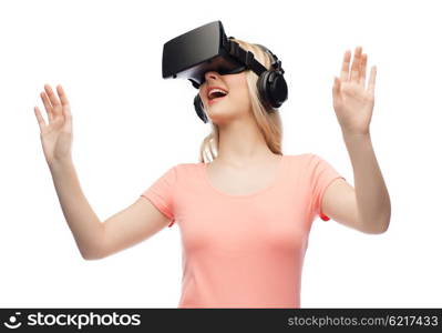 technology, virtual reality, entertainment and people concept - happy young woman with virtual reality headset or 3d glasses and headphones playing game