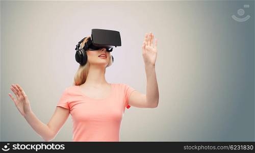 technology, virtual reality, entertainment and people concept - happy young woman with virtual reality headset or 3d glasses and headphones playing game over gray background