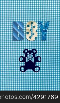 Teddy bear and the word Boy on blue gingham background