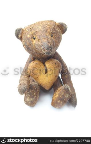 teddy bear handmade and cookie in the form of heart isolated on white